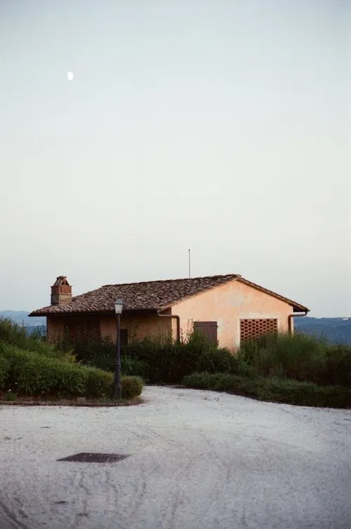 A house with a clock tower on top of it.