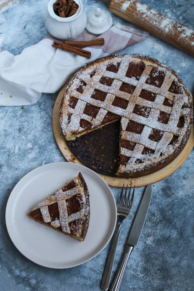 A chocolate pie with a slice cut out of it.